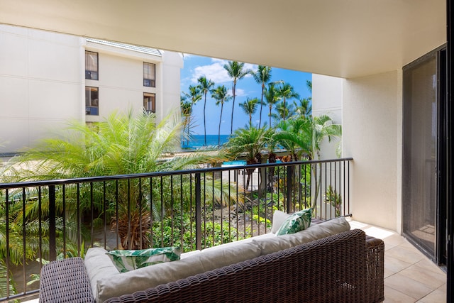 balcony featuring a water view