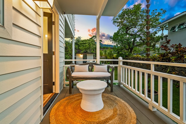 view of balcony at dusk