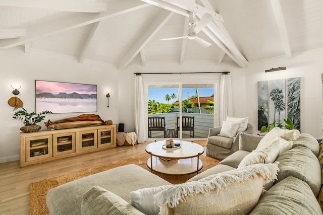 living room featuring hardwood / wood-style floors, ceiling fan, and lofted ceiling with beams