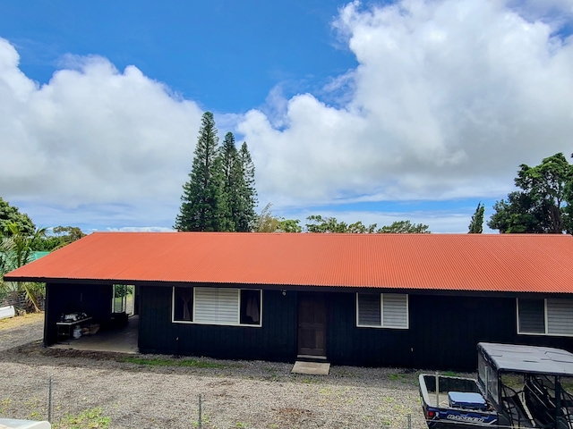 single story home featuring a carport