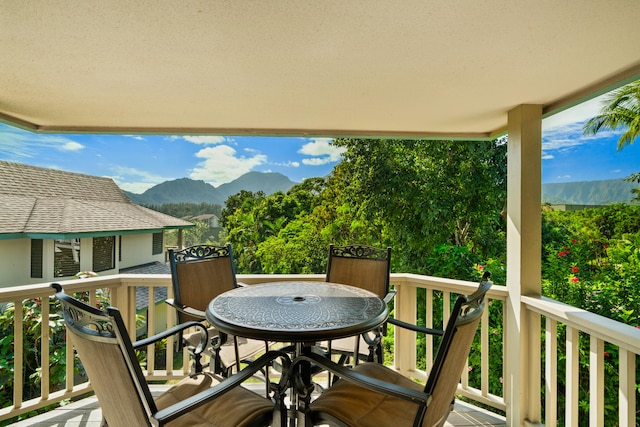 balcony featuring a mountain view