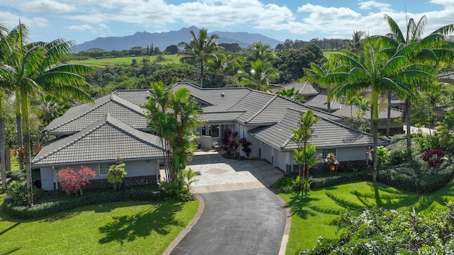 birds eye view of property featuring a mountain view