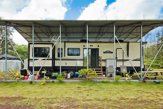 rear view of house with a yard