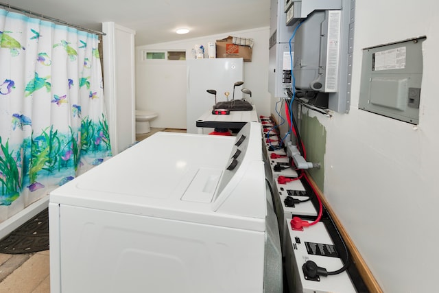 washroom featuring washer and clothes dryer