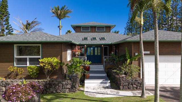 view of front of property with a porch and a garage