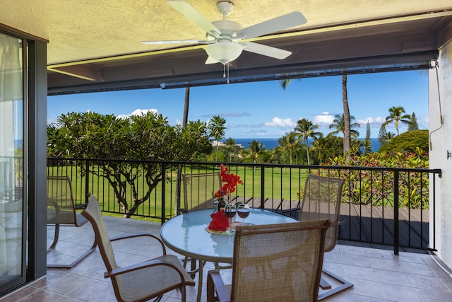 sunroom / solarium with a healthy amount of sunlight and ceiling fan