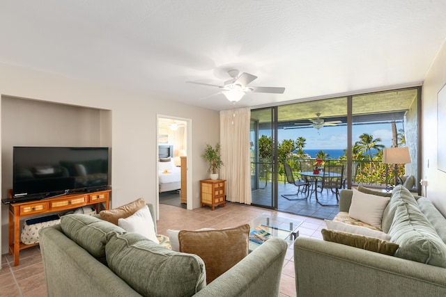 tiled living room with ceiling fan