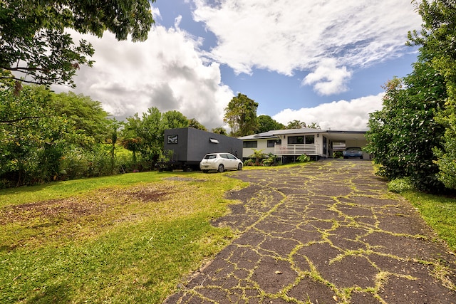 view of yard featuring a carport