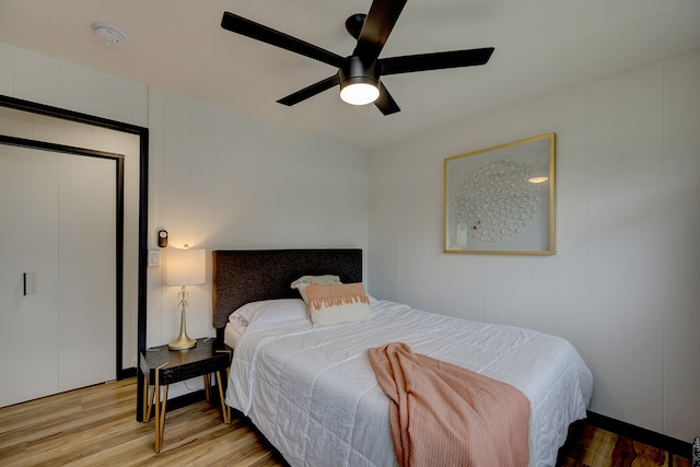 bedroom with ceiling fan and light hardwood / wood-style flooring