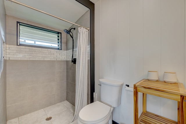 bathroom featuring walk in shower, tile patterned flooring, and toilet