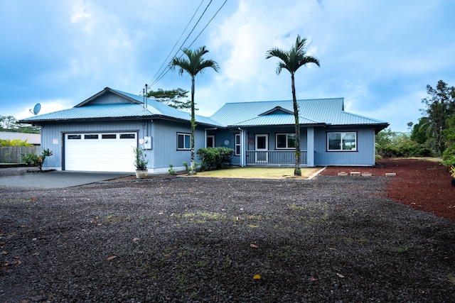 view of front of home with a garage and covered porch