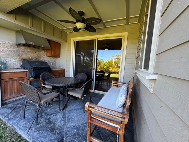 view of patio / terrace with a grill, outdoor dining area, and a ceiling fan