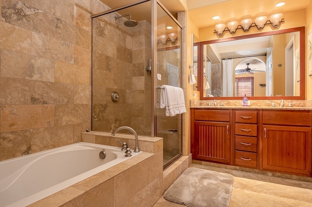 full bath with a sink, a stall shower, a garden tub, and double vanity