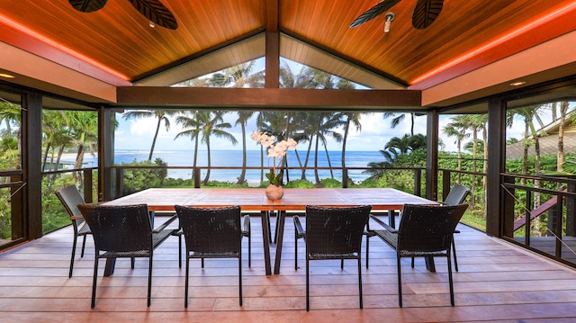 sunroom with a water view, ceiling fan, and wooden ceiling