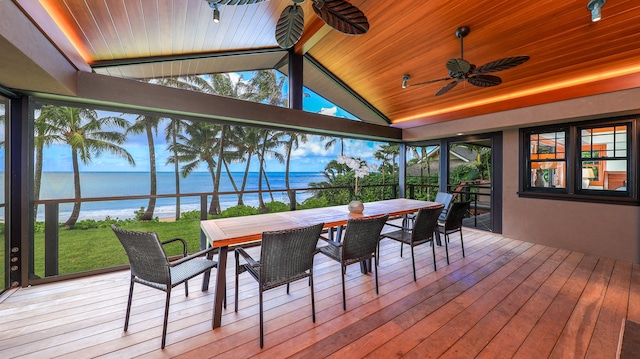 sunroom featuring ceiling fan, a water view, wood ceiling, and vaulted ceiling