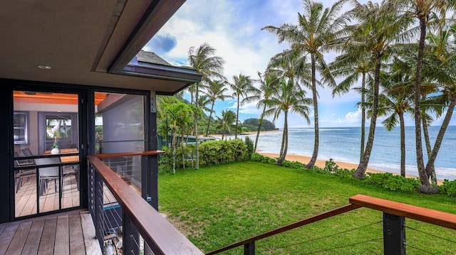 view of yard featuring a water view and a view of the beach