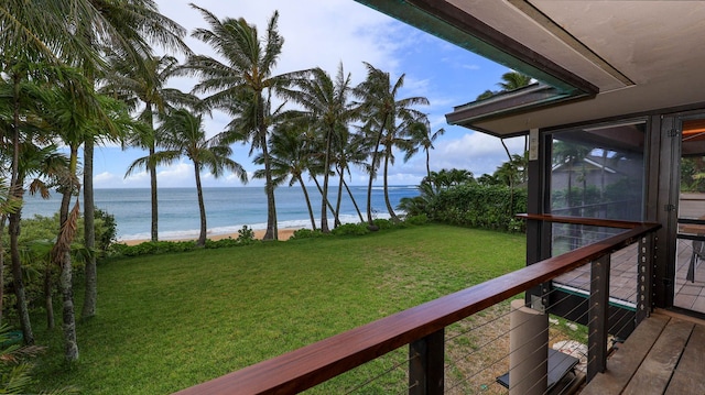 view of yard featuring a balcony and a water view