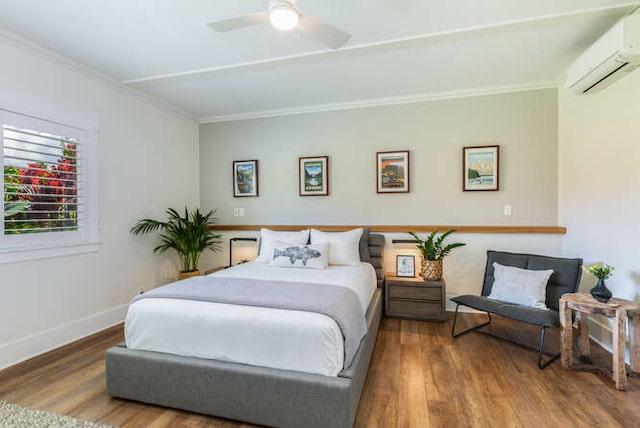 bedroom featuring ceiling fan, ornamental molding, dark hardwood / wood-style floors, and a wall mounted air conditioner