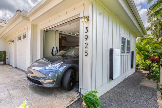 doorway to property with a garage