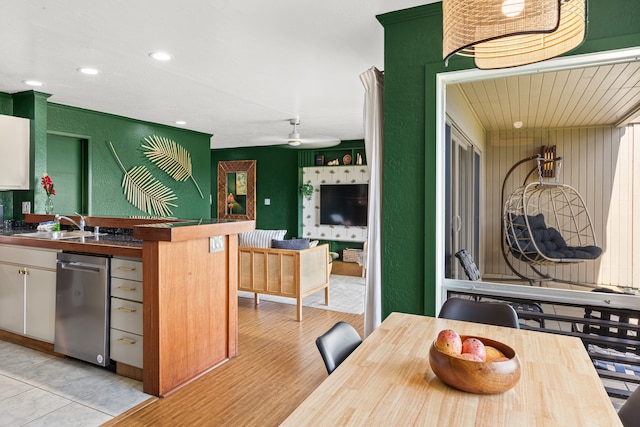 dining room with light hardwood / wood-style flooring and sink