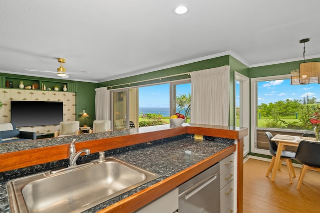 5300 Ka Haku Rd Unit 130, Princeville, HI 96722 - kitchen featuring light wood-style flooring, crown molding, stainless steel dishwasher, tile countertops, and a sink