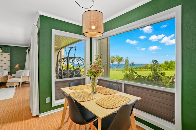 5300 Ka Haku Rd Unit 130, Princeville, HI 96722 - dining room with crown molding, a textured wall, baseboards, and wood finished floors
