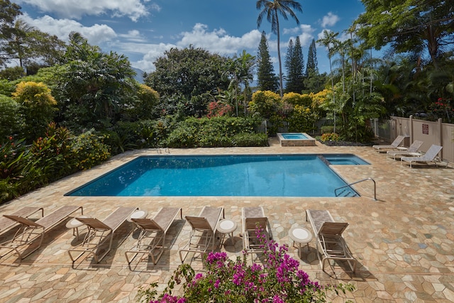 5300 Ka Haku Rd Unit 130, Princeville, HI 96722 - view of pool featuring a patio area, fence, an in ground hot tub, and a fenced in pool