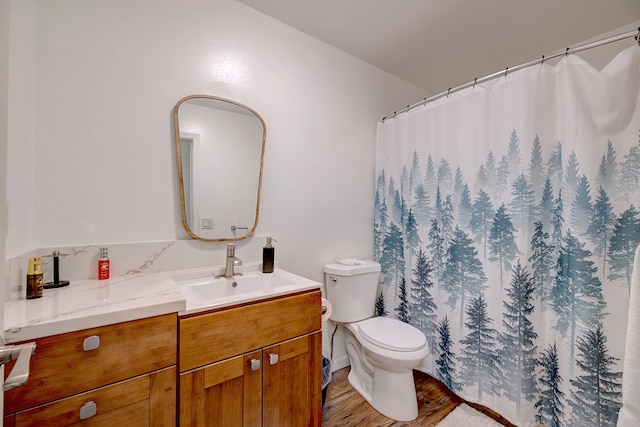 bathroom with vanity, hardwood / wood-style floors, toilet, and a shower with shower curtain