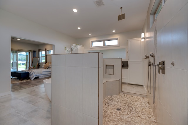 bathroom with shower with separate bathtub, hardwood / wood-style flooring, and a healthy amount of sunlight