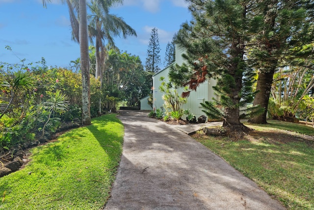 view of side of home featuring a yard