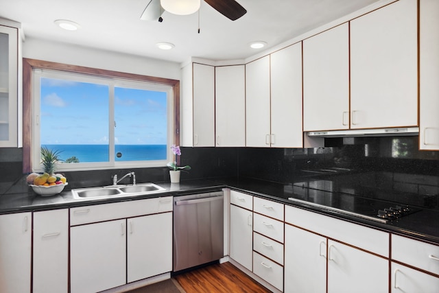 kitchen featuring white cabinets, a water view, sink, stainless steel dishwasher, and cooktop