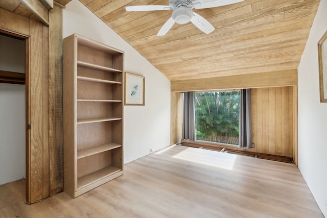 interior space with light hardwood / wood-style flooring, vaulted ceiling, ceiling fan, and wooden ceiling