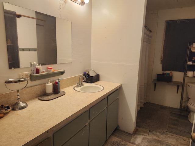 bathroom with vanity and toilet