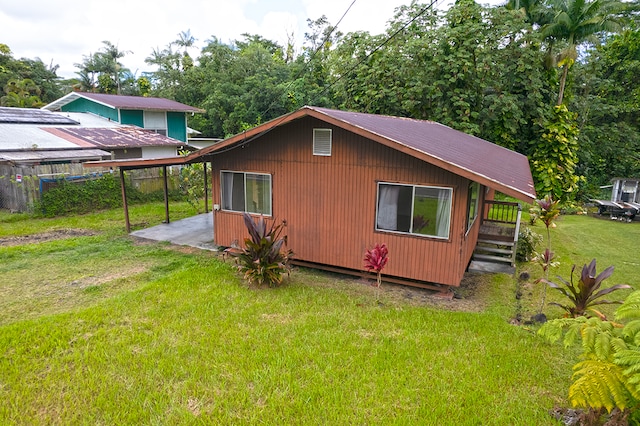 view of outbuilding with a lawn