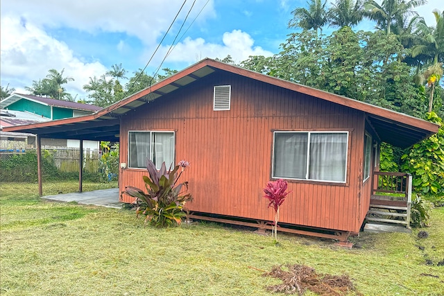 view of home's exterior with a lawn