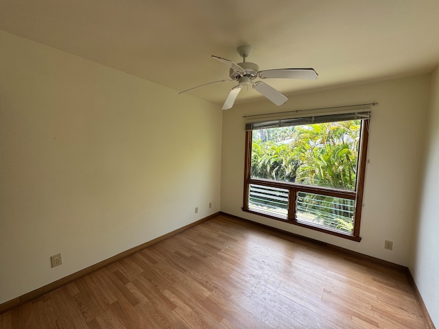 empty room with light hardwood / wood-style flooring and ceiling fan