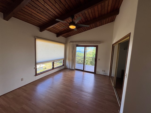 spare room featuring ceiling fan, wood ceiling, lofted ceiling with beams, and hardwood / wood-style floors