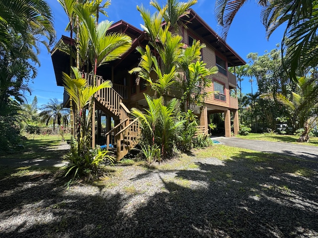 view of side of home with a carport