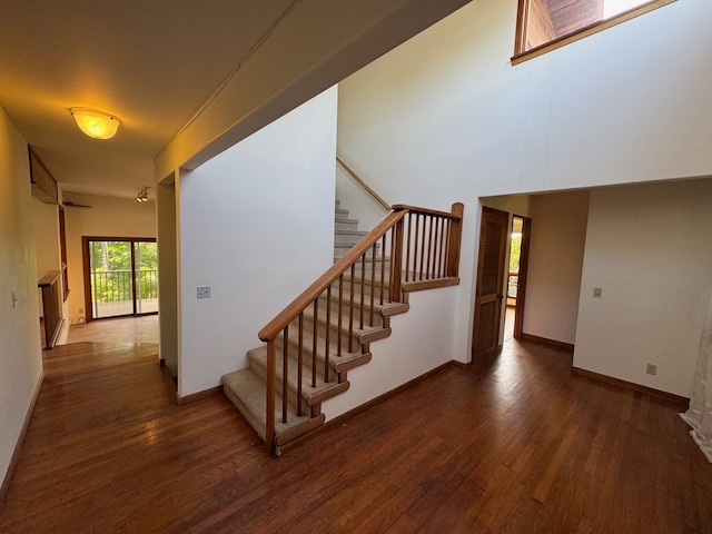 stairs with hardwood / wood-style flooring