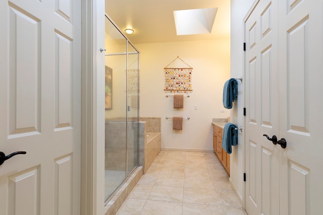 bathroom with vanity, shower with separate bathtub, and tile patterned floors