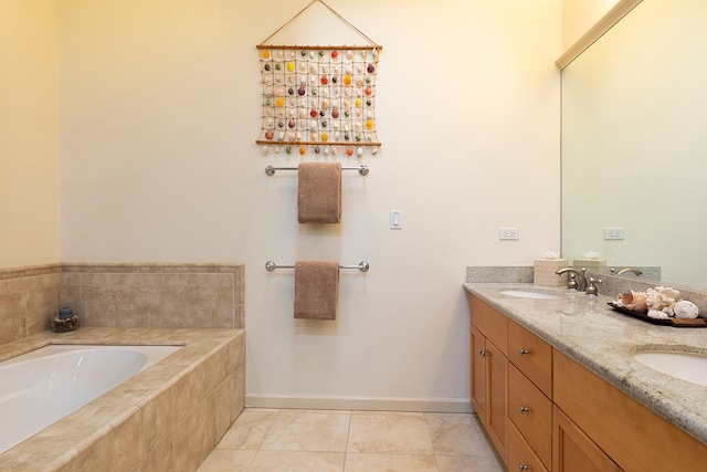 bathroom with vanity and a relaxing tiled tub