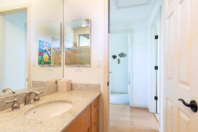 bathroom featuring vanity and hardwood / wood-style floors