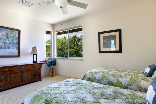 bedroom featuring ceiling fan and light carpet