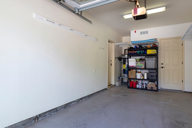 garage featuring a garage door opener