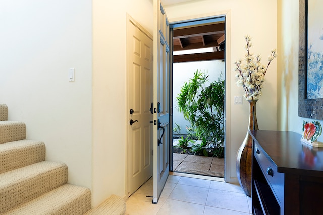 entryway with light tile patterned floors