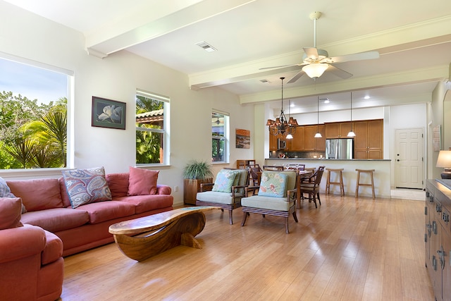 living room featuring beamed ceiling, light hardwood / wood-style flooring, and ceiling fan with notable chandelier