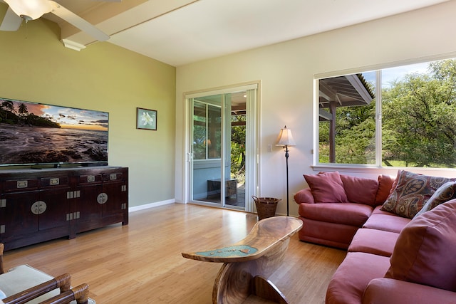 living room with light wood-type flooring and ceiling fan