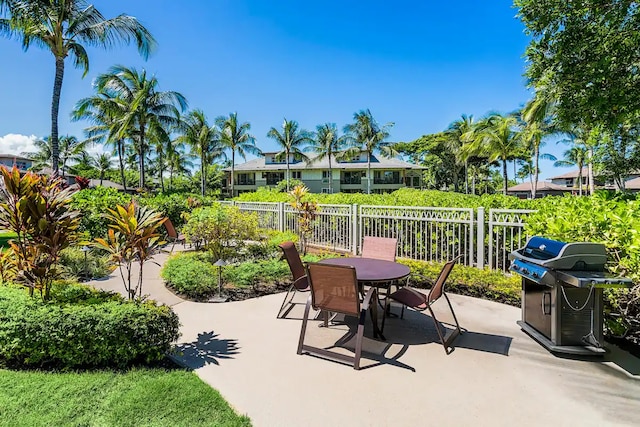 view of patio featuring a grill