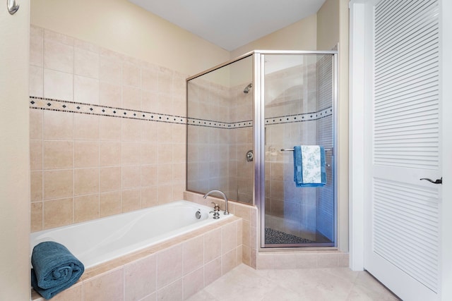 bathroom with tile patterned flooring and plus walk in shower