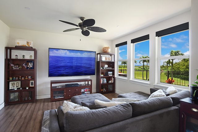 living room with ceiling fan and dark hardwood / wood-style floors